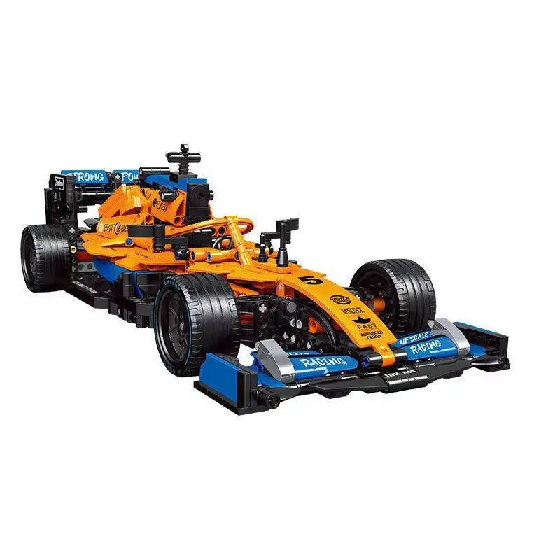 Orange and blue toy race car, a buildable model with number 5, detailed tires and aerodynamic features.